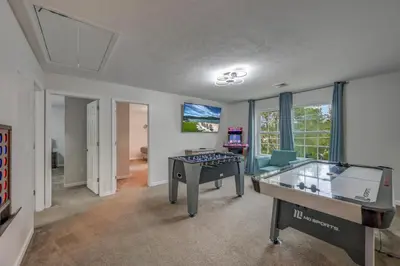 a room with a ping pong table in the middle at Sleeps 12 Fire Pit Game Room Near Camelback in Long Pond