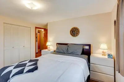 a bedroom with a large bed and two night stands at Three Pines Family Retreat Home in Carlisle in Carlisle