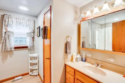 a bathroom with a sink and a shower at Three Pines Family Retreat Home in Carlisle in Carlisle