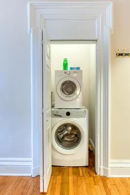 a washer and dryer in a room at Brooklyn Heights 2BR Secret Retreat in Brooklyn