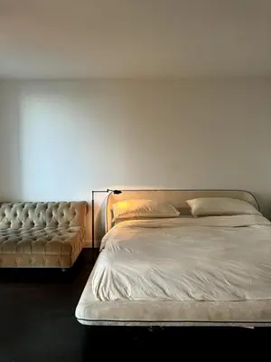 a bedroom with a bed and a couch at Hudson River - Lincoln Center in New York