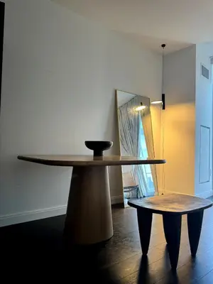 a table and a bench in a room at Hudson River - Lincoln Center in New York