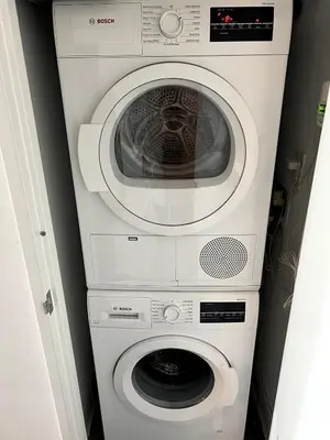 a white washer and dryer in a room at Hudson River - Lincoln Center in New York
