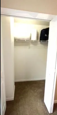a room with a closet with a bed in it at Luxury Townhouse Near West Point in Highland Falls