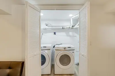 a laundry room with a washer and dryer at Home with Lake Views and Deck in New Jersey Highlands! in Stanhope