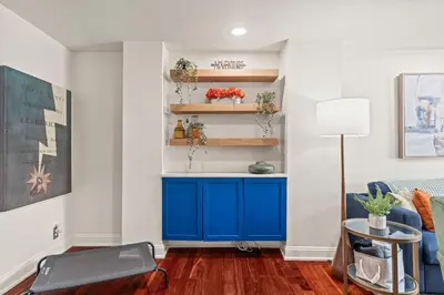 a living room with a blue cabinet and a couch at 3BR Gem in Graduate Hospital in Philadelphia