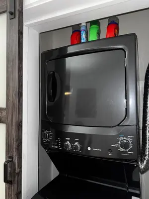 a microwave oven with drinks on top of it at Staten Luxe, Modern Stay Close to NJ, NYC and Brooklyn! in Arlington