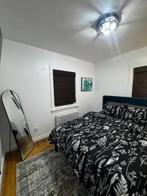 a bedroom with a bed and a window at Staten Luxe, Modern Stay Close to NJ, NYC and Brooklyn! in Arlington