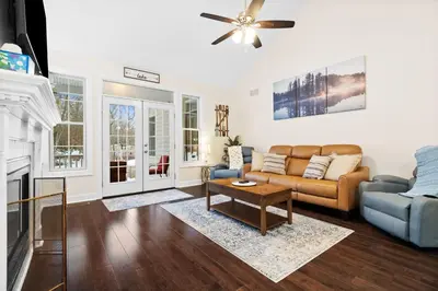a living room with a couch and a fireplace at Hot Tub Game Room Spacious Close to Skiing in Albrightsville