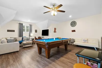 a living room with a pool table in it at Hot Tub Game Room Spacious Close to Skiing in Albrightsville