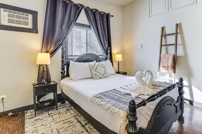 a bedroom with a bed and a window at Games, Fire Pit, Hot Tub Pocono Lake Family Home! in Pocono Lake