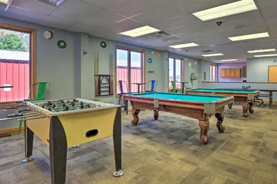 a room with two pool tables in it at Games, Fire Pit, Hot Tub Pocono Lake Family Home! in Pocono Lake