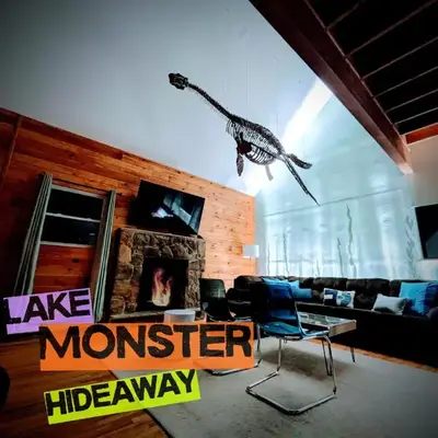 Monster-themed lake front cabin with firepit sauna hot tub game room