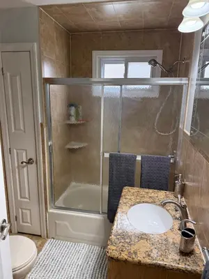 a bathroom with a shower and a sink at Apartment 2 BR near NYC 5min from EWR & 20min from MetLife in Elizabeth