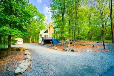 a house in the middle of a forest at 4BDRM Games Family Frndly Fire Pit Masthope in Lackawaxen
