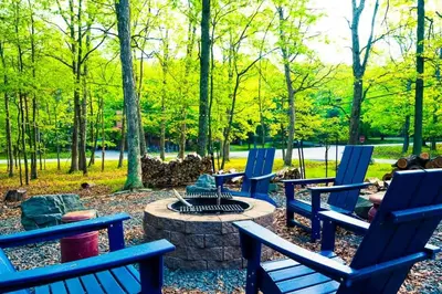 a group of blue chairs around a fire pit in a park at 4BDRM Games Family Frndly Fire Pit Masthope in Lackawaxen