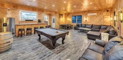 a living room with a pool table and a bar at 6 Bedrooms Hot Tub Game Room Movie Theater in Hawley