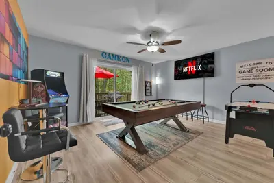 a living room with a pool table and a tv at Hot Tub Game Room Firepit Arrowhead Family in Thornhurst