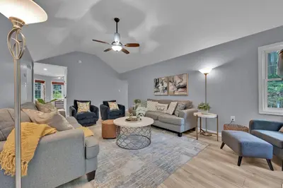 a living room with a couch and a table at Hot Tub Game Room Firepit Arrowhead Family in Thornhurst