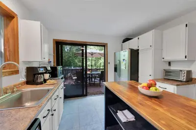 a kitchen with a bowl of fruit on a counter at Charming Getaway Minutes from Lake Wallenpaupack in Tafton