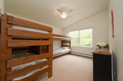a bedroom with a bunk bed and a window at The Lookout Lake Masthope Firepit Arcade in Lackawaxen
