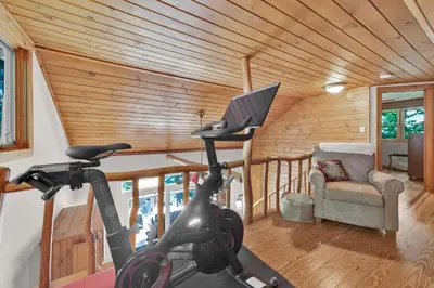 a gym with a treadmill in a room at Lake Wallenpaupack Lakefront Private Boat Slip in Greentown