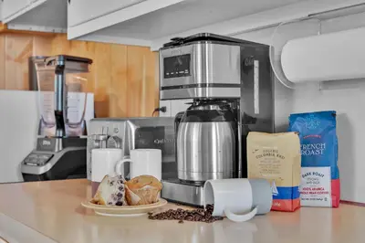 a kitchen counter with a coffee maker and some food at Lake Wallenpaupack Lakefront Private Boat Slip in Greentown