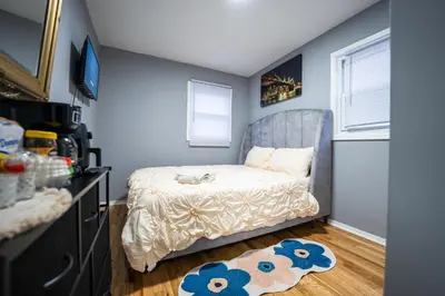 a small bedroom with a bed and a window at Linden Room in Linden