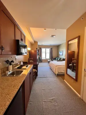 a kitchen with a sink and a bed in a room at The Appalachian at Mountain Creek in Vernon Township