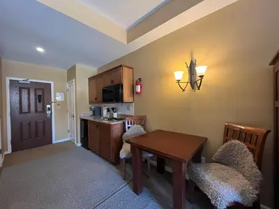 a kitchen with a table and a dining room at The Appalachian at Mountain Creek in Vernon Township