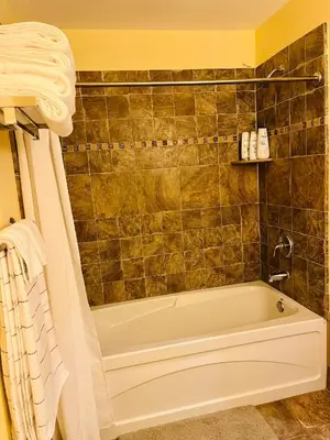 a bathroom with a bath tub in a room at The Appalachian at Mountain Creek in Vernon Township