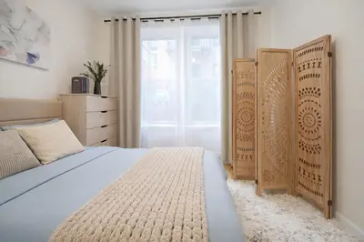 a bedroom with a bed and a dresser and a window at Bright 3BD Unit Close to Columbia University & Central Park in New York