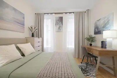 a bedroom with a bed and a desk and a desk at Bright 3BD Unit Close to Columbia University & Central Park in New York