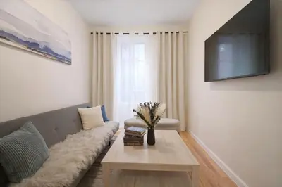 a living room with a couch and a table at Bright 3BD Unit Close to Columbia University & Central Park in New York