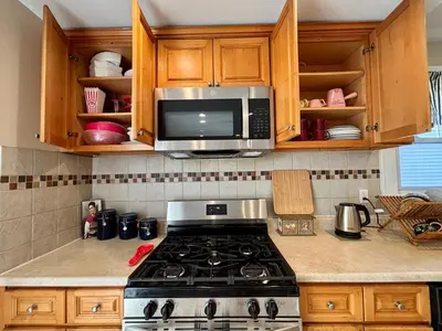 a kitchen with a stove and a microwave at Perfect full private first floor home with convenient amenities in Union