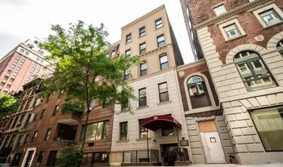 an apartment building on the corner of a street at Synergy Madison in New York