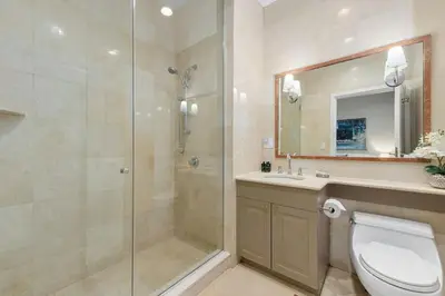 a bathroom with a shower and a toilet and a sink at Synergy Madison in New York