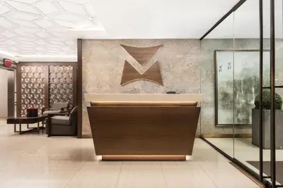 a lobby with a reception desk in a building at Midtown 1BR w Gym Doorman nr Grand Central NYC-746 in New York