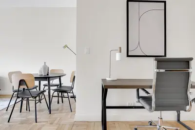 a dining room with a table and chairs at Midtown 1BR w Gym Doorman nr Grand Central NYC-746 in New York