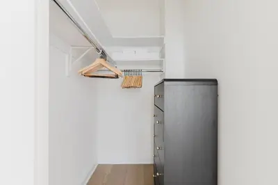 a kitchen with a refrigerator in the corner of a room at Blueground Kips Bay rooftop nr NYC Skyline NYC-2158 in New York