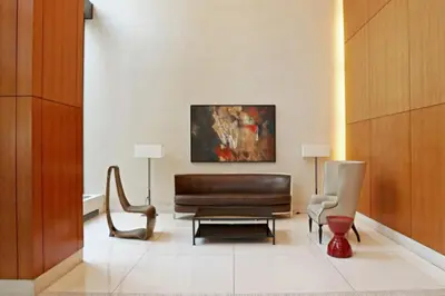 a living room with a couch and a chair at Blueground Kips Bay rooftop nr NYC Skyline NYC-2158 in New York