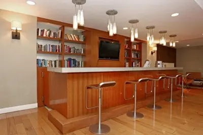 a bar in a library with bar stools at Blueground Kips Bay rooftop nr NYC Skyline NYC-2158 in New York