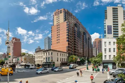 a busy city street with cars and people crossing the street at Blueground Kips Bay rooftop nr NYC Skyline NYC-2158 in New York