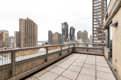 a balcony with a view of the city at Blueground Kips Bay rooftop nr NYC Skyline NYC-2158 in New York