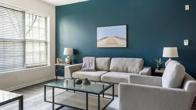 a living room with a couch and a table at Landing Beautiful 2BD Pool Clubhouse in King of Prussia