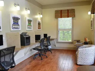 a waiting room with black chairs and a desk at Landing Beautiful 2BD Pool Clubhouse in King of Prussia