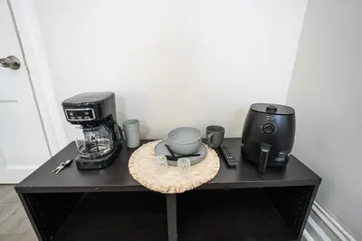 a table with a coffee maker and a coffee machine at Casa Ebenecer - Habitación privada # 3 in Elizabeth