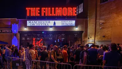 a crowd of people standing in front of a building at Lux Studio Apt - Rooftop - 5 mins to The Fillmore in Philadelphia