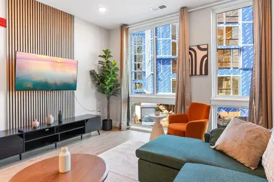 a living room with a couch and a table at 1 bed APT - located next to center city in Philadelphia
