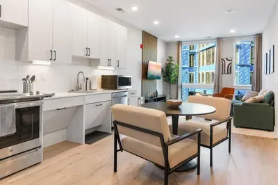 a kitchen and living room with a table and chairs at 1 bed APT - located next to center city in Philadelphia